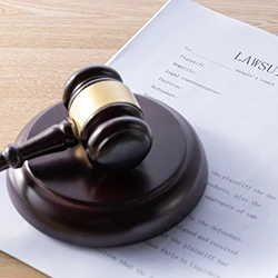 A lawsuit paper and court gavel