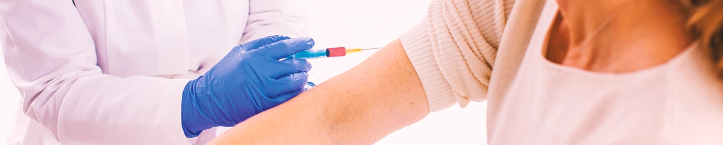 A doctor getting a person's blood