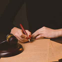A lawyer writing down on brown paper