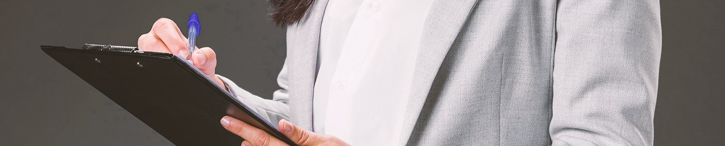 A business person holding a clipboard