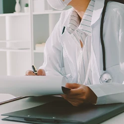 A doctor looking at paperwork