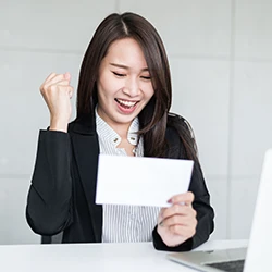 A happy woman who received her non-discretionary bonus pay