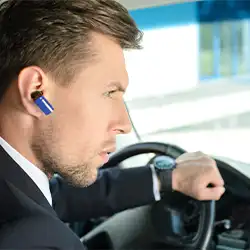 A person using headphone while driving.