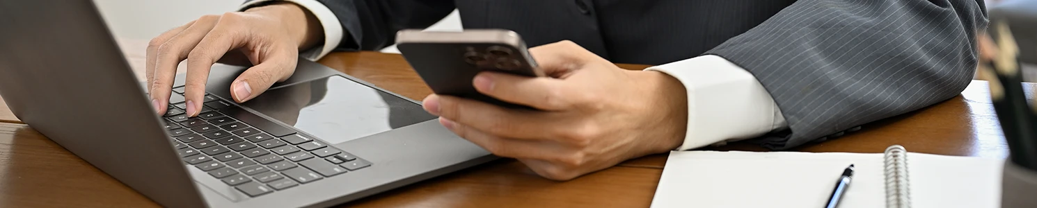 A professional browsing through his phone