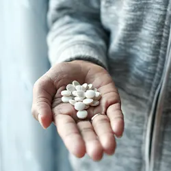 capsules in a woman's hand