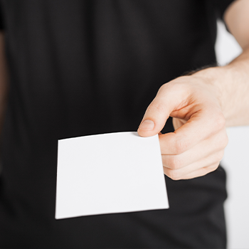 man handing out a paper