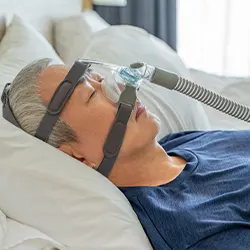 man wearing oxygen machine